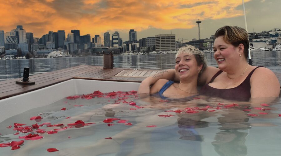HTB_VDAY_G2 Two women in hot tub boat with rose petals
